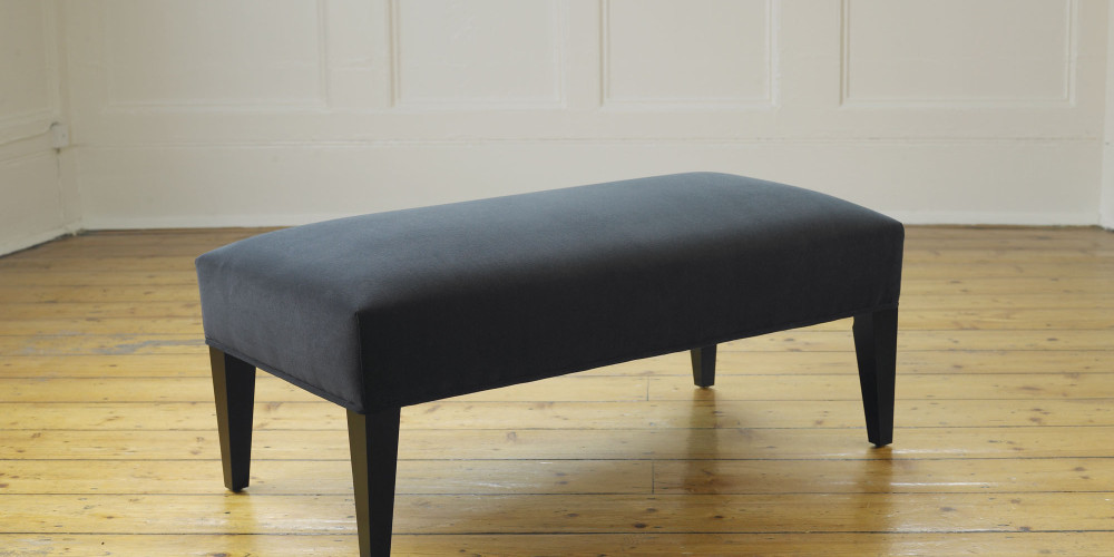 Delcor-bespoke-luxury-footstool-meticulously handcrafted in Britain-choose from over 10,000 fabrics-including velvets-leathers-vast array of patterned and plain materials-available in a broad spectrum of colours-including grey-cream-blue-purple-red-green-and more-each piece showcases timeless design and comfort.