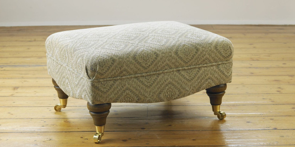 Delcor-bespoke-luxury-footstool-meticulously handcrafted in Britain-choose from over 10,000 fabrics-including velvets-leathers-vast array of patterned and plain materials-available in a broad spectrum of colours-including grey-cream-blue-purple-red-green-and more-each piece showcases timeless design and comfort.